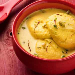 Rasmalai, Bengali delicacy of flattened balls dunked in sweet thickened creamy milk